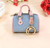 Nouveau mini sac de luxe Sunrise, porte-monnaie de créateur, porte-clés en cuir PU, forme ovale, écologique, haute qualité, portable, logo personnalisé