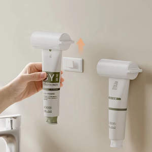 Wholesale Plastic <b>Toothpaste</b> Squeezer Facial Cleanser Hand Manual Seat Holder Stand Rotate Tool - Product Image 1