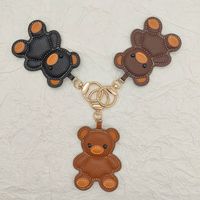 Nouveau porte-clés ours sac breloque PU cuir clé pendentif pour sacs ou voiture élégant porte-clés accessoire