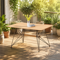 Table à manger rectangulaire industrielle en MDF avec plateau noir et pieds géométriques en fer, idéale pour balcon, patio, maison et jardin.