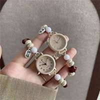 Montre à quartz pour femme NYY avec cordon tressé à perles étoiles mignonnes, cordon de serrage réglable, design écologique en cristal acrylique