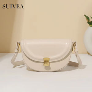Bolso de mujer de moda francesa de nicho italiano bolso de sillín redondo cien veces hebilla de concha PUFlat crema blanco Mini bolso de hombro con textura - Product Image 1