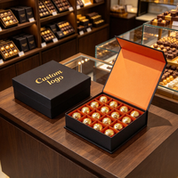 Boîte à chocolat noire personnalisée avec intérieur orange et logo en feuille d'or pour les acheteurs en gros de pralines et de truffes