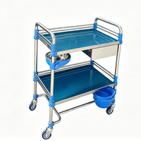 Chariot à instruments en acier inoxydable à 2 niveaux avec roues silencieuses pour usage hospitalier et clinique