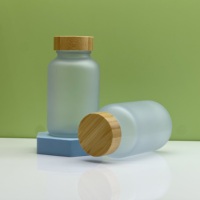 Bouteille de capsule en verre à large bouche 200cc pot de bouteille de pilule en verre pour pilules médicales avec bouchon en bambou en bois