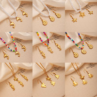 Nouveau design Collier chaîne à maillons en acier inoxydable plaqué or 18 carats pour femme, avec pendentif dauphin, coquillage et pieuvre, thème Océan d'été