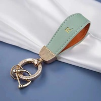 Nouveau porte-clés coloré, simple et écologique en alliage de zinc et cuir PU pour voiture, anti-perte, accessoires haut de gamme, vente en gros
