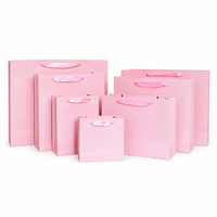Sacs cadeaux en papier cartonné blanc personnalisés pour ensembles de mode, emballages d'achat personnalisés pour les boutiques de détail