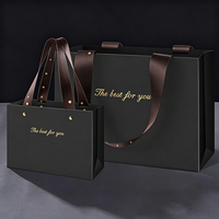 Luxuriöse Einkaufstaschen mit Goldprägung-Design, Langlebiger Griff, Kunstpapier-Kartonverpackung für Werbung und Kleinunternehmen