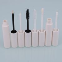 Vente en gros de tubes de mascara de haute qualité Conteneur vide pour eye-liner rose et tube de brillant à lèvres blanc