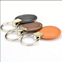Porte-clés ronds en cuir PU gaufré personnalisé Porte-clés avec logo de marque Porte-clés de voiture Accessoire Cadeau personnalisé pour hommes et femmes