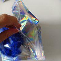 Emballage pour jouets en peluche en plastique laminé OPP, avec fermeture éclair transparente sur le devant, différentes tailles, dos holographique brillant, imprimé par gravure et film laser