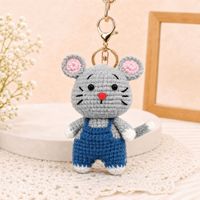 Vente en gros de porte-clés animaux du zodiaque tricotés à la main, pendentifs de sac à dos en crochet mignons de style dessin animé, articles décoratifs en stock
