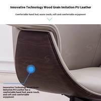 Chaise de bureau ergonomique minimaliste en cuir à dossier haut, pivotante, avec support lombaire réglable, design épuré pour espace de travail
