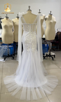 Robe de mariée sirène moderne ZB5839 avec décolleté plongeant, dos nu, cape transparente, bretelles, broderies florales, dentelle florale 3D et tulle, traîne chapelle