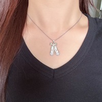 Collier pendentif chaussures de ballet pour filles et femmes, design nœud papillon, zircone cubique, collier ballerine, bijoux de danse tendance, cadeau