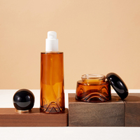 Bouteille en verre de luxe personnalisée en gros, ronde ambrée et carrée noire, pour sérum, lotion, parfum, huile, avec bouchon à bille et pulvérisateur rechargeable