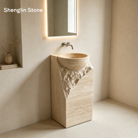 Évier en travertin naturel monobloc sculpté avec texture brute ciselée pour la rénovation des salles de bain de villas et d'hôtels