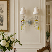 Applique murale en cristal à 2 têtes, style luxe léger français, avec cadre en fer plaqué, abat-jour en tissu et pompon en cristal jaune, pour chambre, hôtel, villa, hall