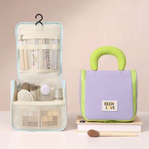 Organisateur de voyage multifonctionnel en tissu pour articles de toilette, sac de rangement suspendu pour cosmétiques et produits de lavage avec crochet pour salle de bain et maquillage - Product Image 1