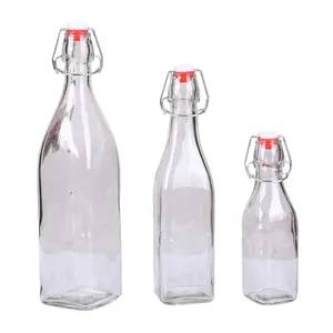 Bottiglie di vetro della bottiglia di vetro del latte del succo della bottiglia di acqua di vetro di prezzo diretto della fabbrica con i coperchi dell'oscillazione
