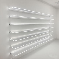 Vêtements de mode personnalisés pour magasins de détail Meubles de présentation murale en bois Étagère acrylique à LED Étagère de présentation murale à vendre