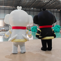 Costume de mascotte cochon noir et blanc gonflable personnalisé pour événements publicitaires, avec ventilateur intégré