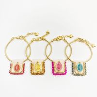 Bracelet religieux bohème en textile tricoté à la main avec breloque émaillée Vierge Marie et chaîne serpent dorée réglable
