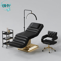 Lit de massage cosmétique électrique pour cils Table de massage spa de luxe Lit pour salon de beauté Mobilier d'esthéticienne Base dorée Lit incurvé pour le visage