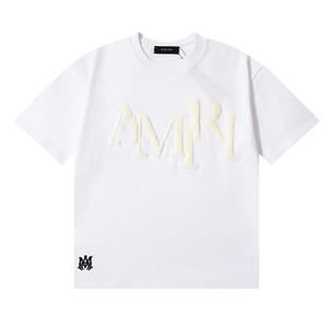 เสื้อยืดคอตตอนแท้พิมพ์ลายโฟมตัวอักษร Ami แบรนด์แฟชั่นยุโรปอเมริกา XX ทรงหลวม ระบายอากาศได้ดี สำหรับผู้ชายและผู้หญิง - Product Image 3