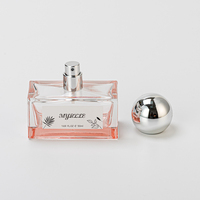 Flacon de parfum rectangulaire de luxe en verre rose transparent, longue durée, avec bouchon en forme de boule