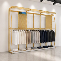 Système d'affichage mural pour vêtements en métal noir à dessus incurvé, avec boîte lumineuse LED, logo et panneau perforé sur mesure