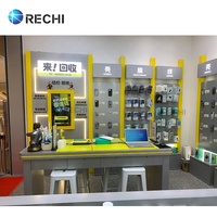 Mesa de mostrador de exhibición de consola de juegos de madera con diseño de accesorio de tienda electrónica RECHI con gabinete de almacenamiento y póster de anuncio cambiable
