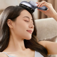 Masseur électrique du cuir chevelu à lumière rouge amélioré, peigne de massage portable pour la tête avec atomisation d'huile capillaire pour la maison