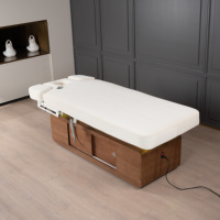 Table de massage professionnelle moderne en PU blanc laiteux avec télécommande 4 moteurs et éponge haute densité pour hôtels, salons de beauté, gymnases et écoles