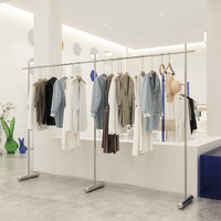 Portant à vêtements créatif en acier inoxydable et acrylique sur pied pour magasin de vêtements féminins, présentoir de magasin avec accessoires pour ceintures