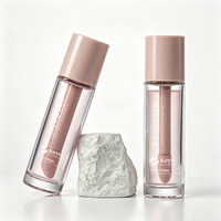 Flacon en verre givré rose de luxe de 30 ml (1 oz) vide pour fond de teint, correcteur, blush liquide, huile à lèvres, gloss avec un grand applicateur en forme de patte de chèvre