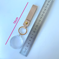 Llavero de acrílico redondo en blanco para fotomatón con correa de cuero PU de impresión personalizada y marco para insertar fotos de 35 mm para negocios de fotomatones
