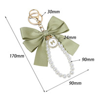 Porte-clés en ruban perlé avec breloque nœud en cristal pour femme et fille, accessoire de mode en tissu de soie, pendentif pour sac