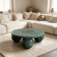 Table basse ronde de luxe en marbre vert avec base sphérique en marbre naturel au design minimaliste