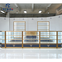 Nouvelle conception de vitrine de bijouterie avec éclairage LED, comptoir de présentation de bijoux en or, vitrine circulaire simple, design de kiosque de centre commercial, kiosque à bijoux