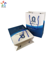 Bolsa de Cartón Blanca de Lujo Personalizada con Logotipo en Dorado para Empacar Ropa, Vestidos, Regalos, Compras, Manualidades, con Asa Elegante