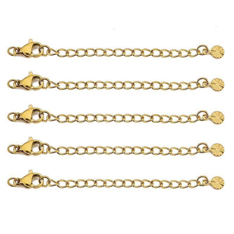 Piezas redondas con relieve dorado.