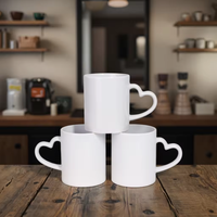 Vente en gros de tasses magiques en porcelaine de 11 oz avec poignée en forme de cœur, vierges pour sublimation, sans BPA, résistantes à la chaleur, écologiques, pour la Saint-Valentin