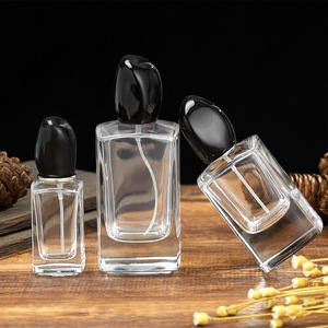 Botella de perfume de lujo con tapa negra, transparente, de vidrio, con atomizador a presión, de 30ml, 50ml, 100ml, para viajes y cuidado personal. - Product Image 1