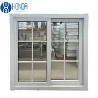 Fenêtre coulissante en verre double UPVC avec conception de gril comprenant une moustiquaire pour une sécurité et un confort améliorés à la maison