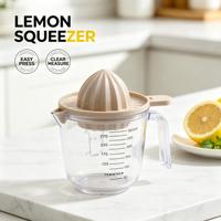 Presse-citron manuel en plastique, presse-agrumes avec tasse graduée et passoire