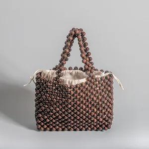 Custom stylish summer women's environmental handbag hand-woven wood beads bag with lining drawstring