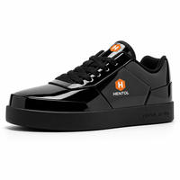 Chaussures de skate à lacets en cuir véritable noir, personnalisables OEM, avec emblème orange brillant, semelle plate, pour skateboard, hiver et printemps, en mesh
