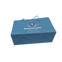Sacs shopping en papier bleu personnalisés en gros avec poignée en corde et impression de logo pour emballage cadeau